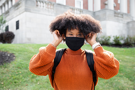 Student wearing a mask on campus