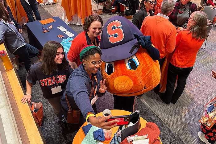 Otto posed for the happiest selfies at the Homecoming Alumni Breakfast. displayed in a new window